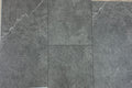 Gray tiles on a wooden floor