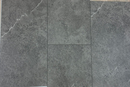 Gray tiles on a wooden floor