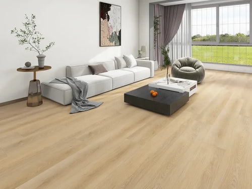 Modern living room with wooden flooring, white sofa, and large window.
