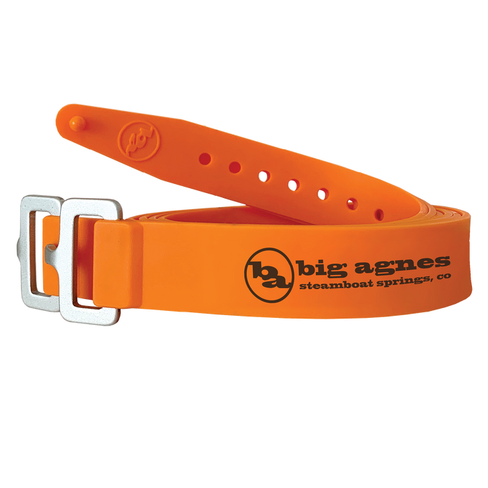 Orange belt with metal buckle and Big Agnes Returns logo on a white background