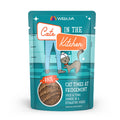 A teal pouch of Cats in the Kitchen Cat Times at Fridgemont cat food, featuring a cartoon cat and human legs, with cage-free duck and wild-caught tuna in a creamy paté hydrating purée.