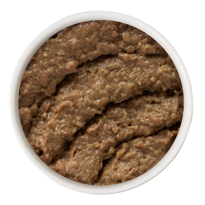 A round white bowl filled with moist, brown Weruva Chicken and Beef Dinner in a Hydrating Purée for cats, viewed from above against a white background.