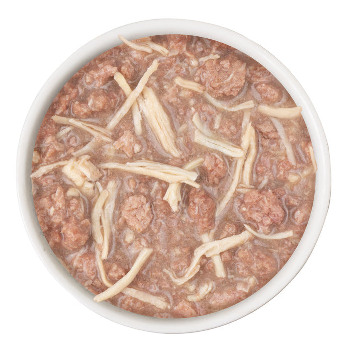 A white bowl with BFF Best Feline Friend Chicken Cha Cha Cha!—a grain-free, shredded meat and sauce wet food for growing kittens—seen from above on a plain white background.