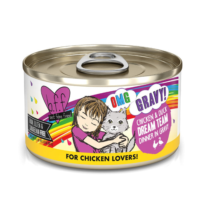 A can of BFF Best Feline Friend Chicken & Duck Dream Team cat food shows a cartoon girl hugging a gray cat, with text highlighting cage-free chicken & duck in gravy. The label notes it's grain, gluten, and carrageenan free.