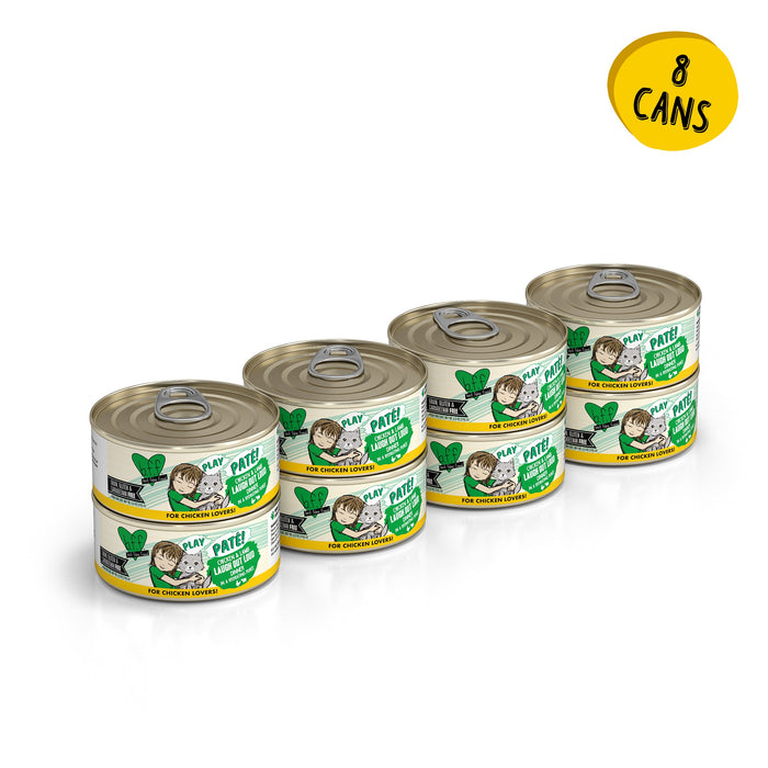 Eight cans of BFF Best Feline Friend’s “Chicken & Lamb Laugh Out Loud” grain free wet cat food are stacked in two columns. Each can has a white and green label with a cat, green leaves, and a yellow circle reading “8 CANS.”.