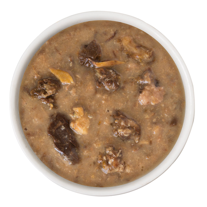 A white bowl filled with chunky BFF Best Feline Friend Chicken, Turkey, & Salmon Purr-Fect Plannin'! cat food, showing visible chicken and meat pieces, photographed from above on a white background.