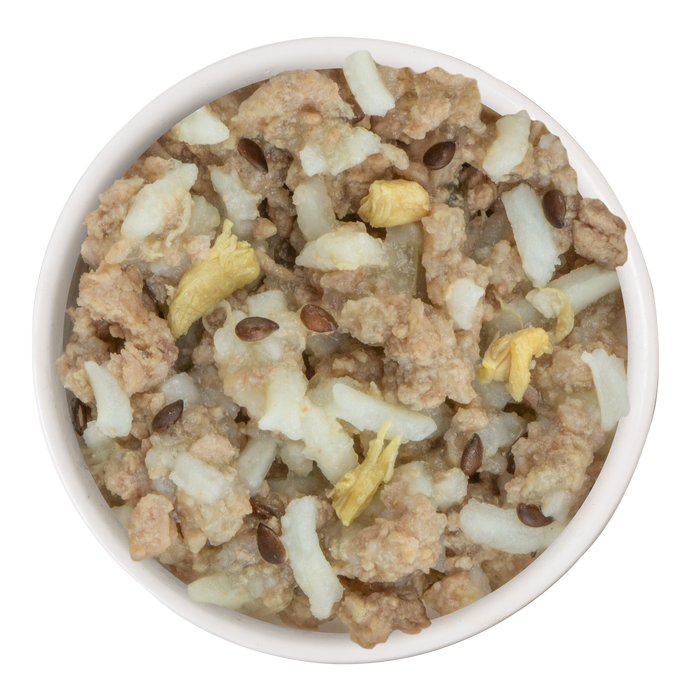 A bowl of Weruva Duck and Rice Dinner—chunky ground duck, rice, veggies, and flax seeds—makes an indulgent, wholesome meal for your dog.