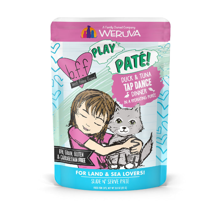 A colorful pouch of BFF Best Feline Friend Duck & Tuna Tap Dance cat food, featuring wild-caught tuna and cage-free duck, with an illustration of a girl hugging a gray cat and various product labels on the packaging.