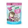 A colorful pouch of BFF Best Feline Friend Duck & Tuna Tap Dance cat food, featuring wild-caught tuna and cage-free duck, with an illustration of a girl hugging a gray cat and various product labels on the packaging.