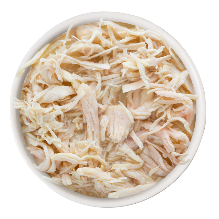 A white bowl containing Soulistic Good Karma, featuring shredded, high-quality protein from cooked chicken, is set against a white background.