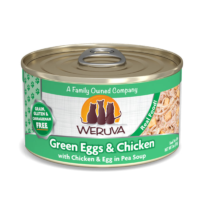 A can of Weruva Green Eggs & Chicken cat food—grain, gluten, and carrageenan free—for obligate carnivores, with shredded chicken in pea soup. Features three cat silhouettes and "A Family Owned Company" on the label.