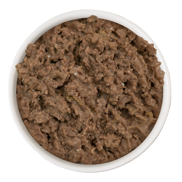 A white bowl filled with moist, brown Lamb Burger-ini by Cats in the Kitchen, a high-protein, grass-fed lamb wet cat food, viewed from above against a white background.
