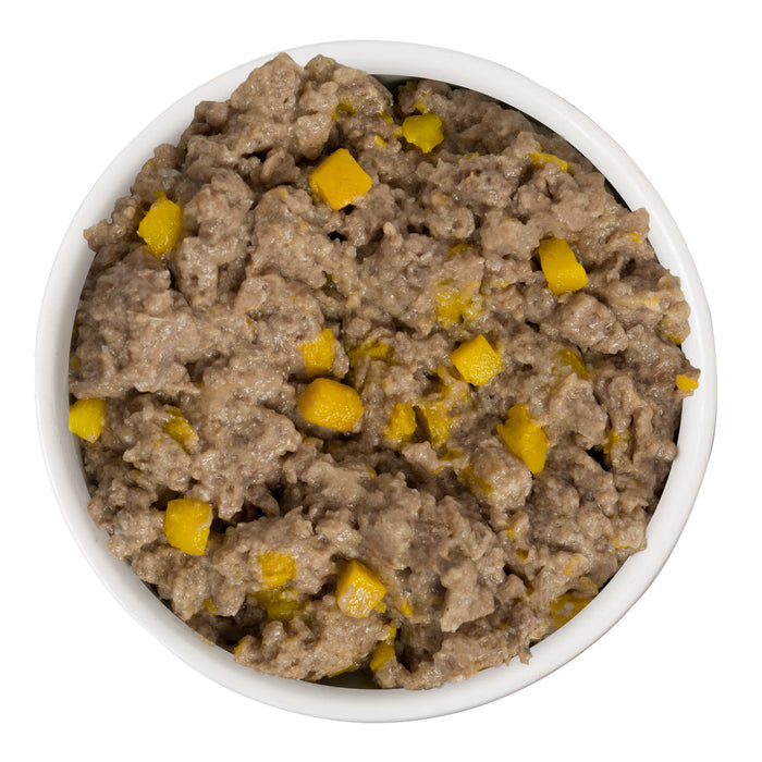 A white bowl of Dogs in the Kitchen's Lamburgini, featuring ground lamb and small yellow diced ingredients, on a white background.