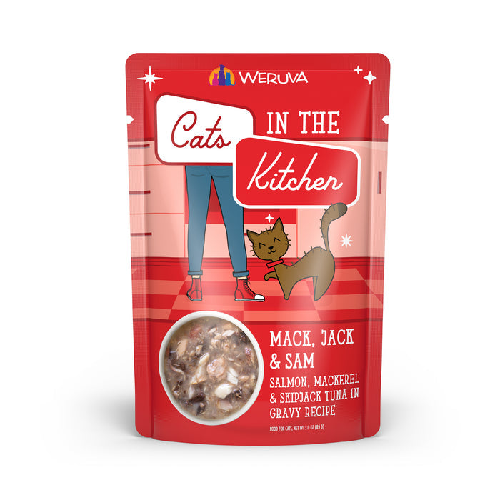 A red pouch of Cats in the Kitchen Mack, Jack and Sam cat food with wild-caught salmon, mackerel, and skipjack tuna in gravy. The package features illustrated legs, a cat image, and a food logo on front.