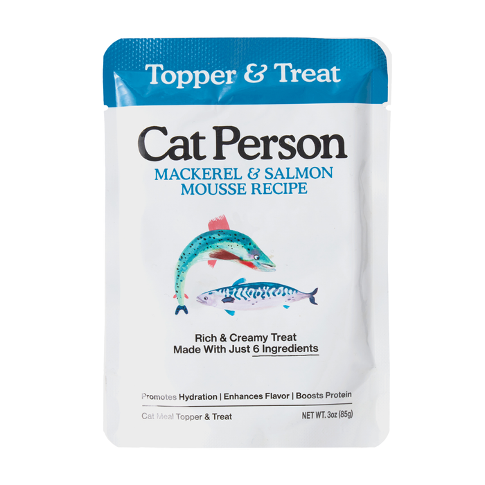 A pouch of Cat Person Mackerel & Salmon Mousse cat treat, featuring salmon and mackerel art, and text highlighting its creamy texture, six simple ingredients, and seafood flavor cats crave.