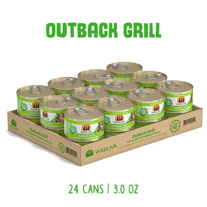 A cardboard tray holds 24 cans of Weruva Outback Grill cat food. Each green label features trevally and sardine, with "OUTBACK GRILL" at the top and "24 CANS | 3.0 OZ" at the bottom.