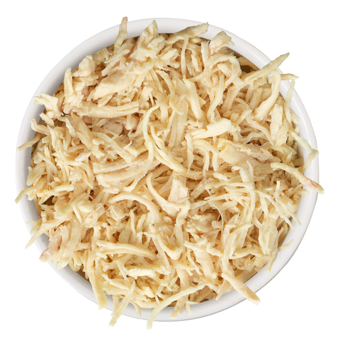 A white bowl filled with Quick 'N Quirky shredded hash brown potatoes by TruLuxe, enriched with refined nutrition and viewed from above against a white background.