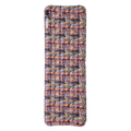 Multicolored inflatable camping pad on a white background