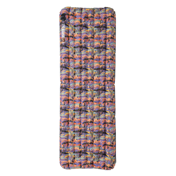 Multicolored inflatable camping pad on a white background