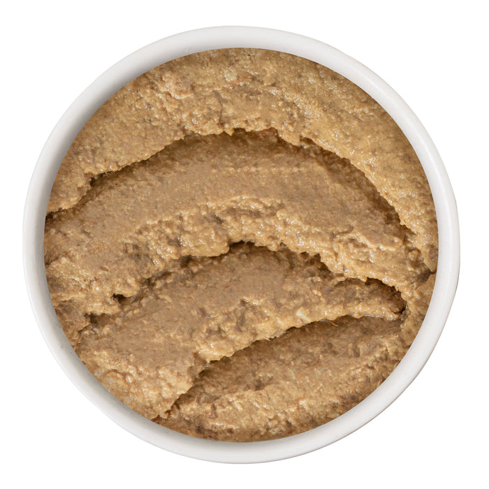A white bowl filled with smooth, light brown BFF Best Feline Friend Salmon & Tuna Tuck Me In grain free pâté is shown from above on a white background. Swirl marks are visible on the pâté’s surface.