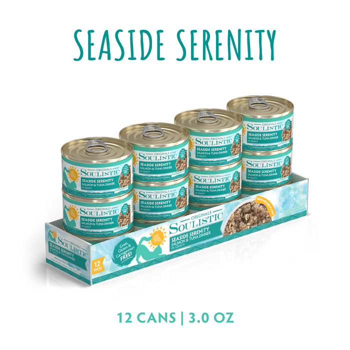 A display of 12 Soulistic Seaside Serenity canned cat foods, each 3 oz with teal labels. Made with wild-caught tuna, grain-free, and features an image of the food plus a sun with a cat silhouette.