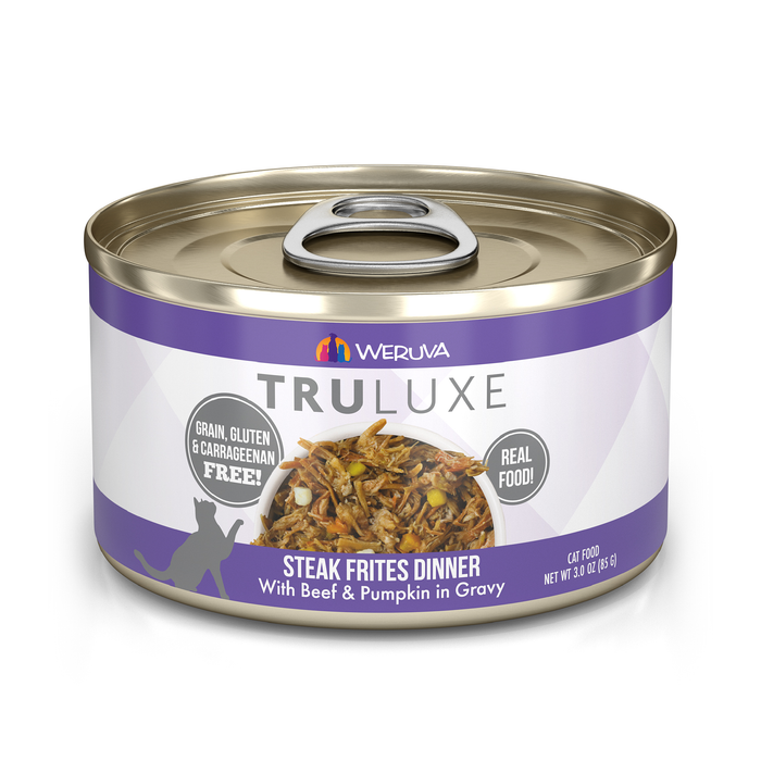 A can of TruLuxe Steak Frites Dinner cat food with Australian grass-fed beef and pumpkin in gravy, offering refined nutrition. It’s grain, gluten, and carrageenan free, with a purple-accented label showing the food.