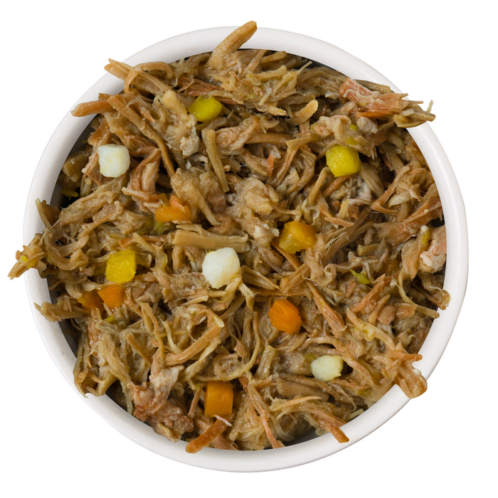 A white bowl filled with TruLuxe Steak Frites Dinner—shredded Australian grass-fed beef mixed with carrots, potatoes, and peas—for refined nutrition cat food.
