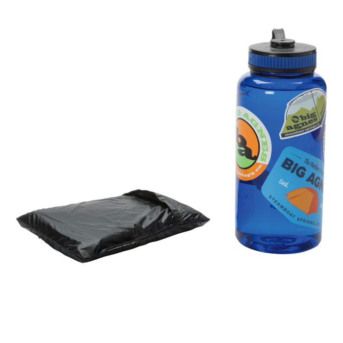 The Big Agnes Returns String Ridge VST 1.5 Footprint, a black folded ground cloth, is placed beside a blue reusable water bottle with stickers on a white background.