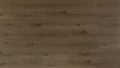Close-up of a wooden surface with a dark brown color.