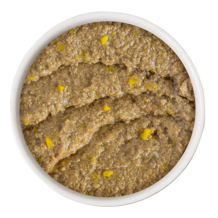 A white bowl of The Breakfast Cat by Cats in the Kitchen shows chunky olive tapenade with visible greenish-yellow olives, photographed from above on a white background—perfect with creamy paté for an elevated spread.