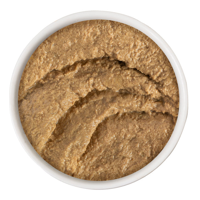 A white bowl filled with thick, brown Tuna & Beef Blast Off! paste from BFF Best Feline Friend, viewed from above. The textured, swirled surface makes it perfect to pair with grain free meals.