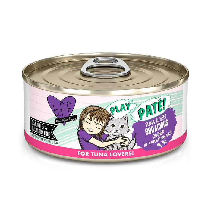 A can of BFF Best Feline Friend Tuna & Beef Bodacious cat food in hydrating purée, made with wild-caught tuna and grass-fed beef. The label shows a child hugging a gray cat and says "For Tuna Lovers!" This meal is grain free.