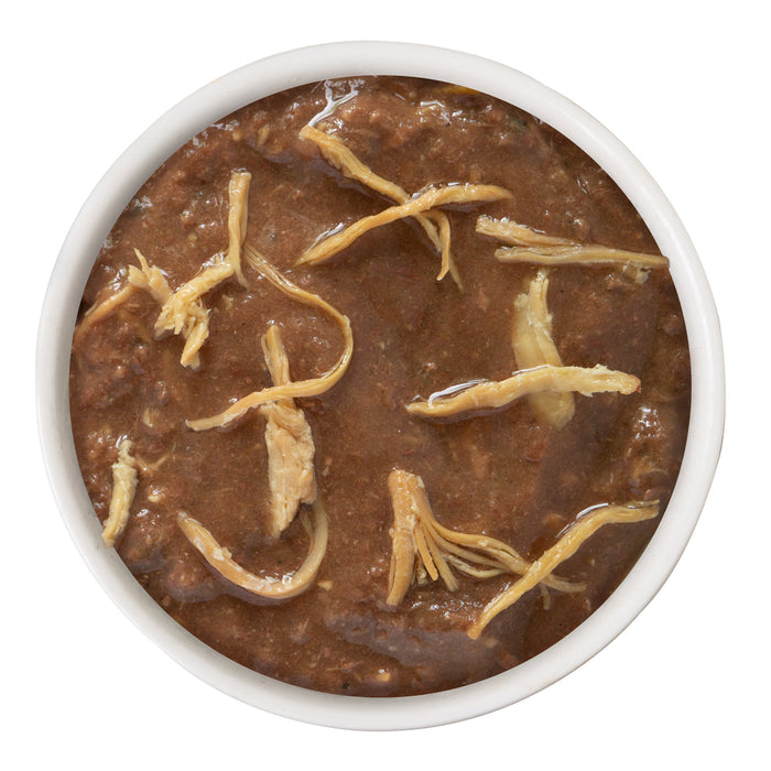 A white bowl filled with BFF Best Feline Friend Tuna & Chicken Chase Me in thick gravy, viewed from above on a white background—perfect for gravy-loving cats.
