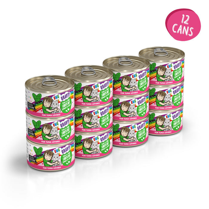 Twelve cans of BFF Best Feline Friend Tuna & Lamb Lights Out cat food are stacked in three rows of four. Each can has a colorful label with a cartoon cat and vibrant designs—a pink circle at the top right reads "12 cans" in white text.