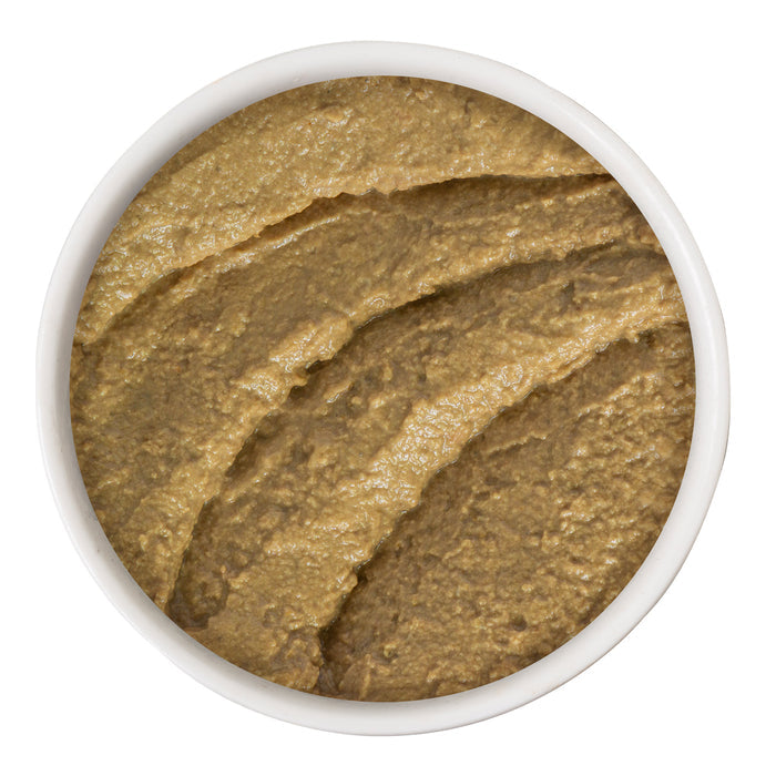 A small white bowl is filled with BFF Best Feline Friend Tuna & Salmon Oh Snap!—a thick, brownish-green, grain-free paste with smooth swirl marks on top. The background is plain white.