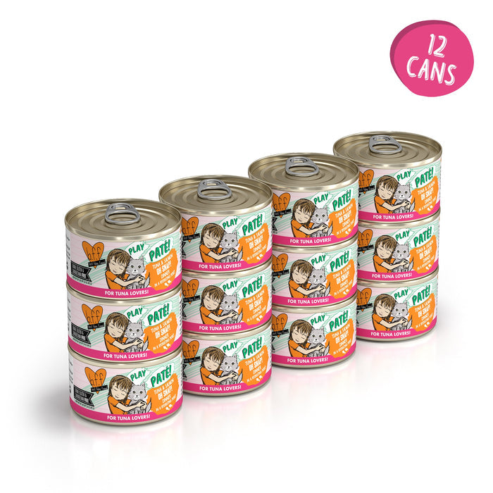 Twelve stacked cans of BFF Best Feline Friend Tuna & Salmon Oh Snap! grain free paté for cats, with illustrated labels showing a cat and person, plus a pink circle in the corner that reads "12 cans.