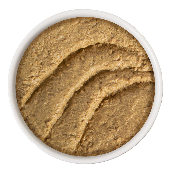 A white bowl of smooth, light brown Tuna & Salmon Shhh... pâté by BFF Best Feline Friend is shown from above, with visible textured swirls on the surface.