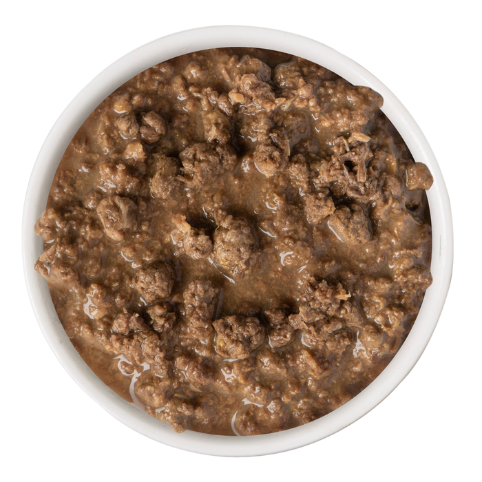 A white bowl filled with moist, brown minced tuna in sauce—a savory cat entrée—featuring BFF Best Feline Friend's Tuna Too Cool, viewed from above on a white background.