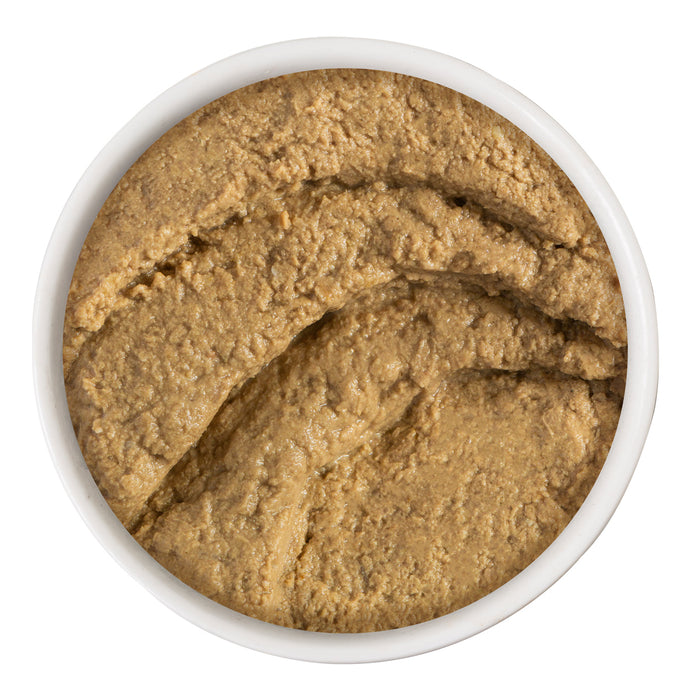 A white bowl filled with BFF Best Feline Friend Tuna & Turkey Totes! is shown from above on a white background, displaying the brown, coarse, paste-like pet food.