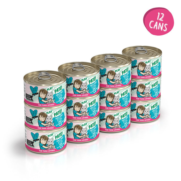 Twelve cans of BFF Best Feline Friend Tuna & Turkey T.T.Y.L. grain free cat food are stacked in three rows. The colorful labels show a cartoon cat, fish, and a pink circle with "12 cans" in white text.