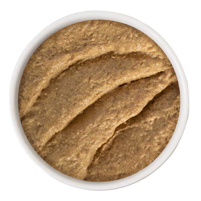 A small bowl filled with Turkey & Tuna Twinkles grain-free cat food by BFF Best Feline Friend, shown from above with a smooth, swirled surface.